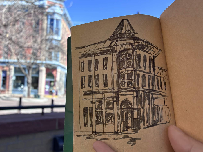 Drawing of a building on a street corner